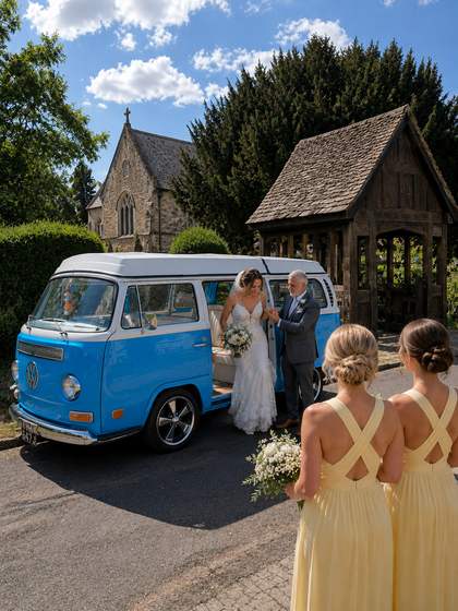Bridesmaids in mustard yellow, gathered beside Mabel at the church door.