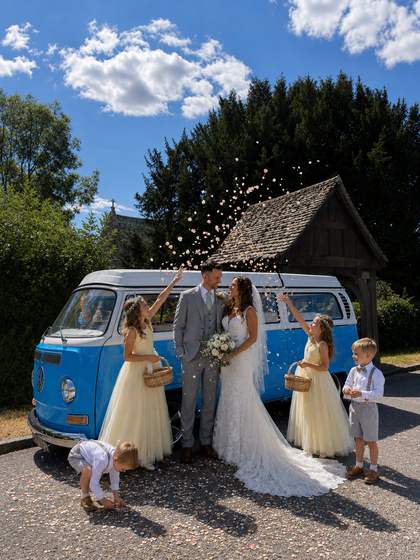 Confetti catching the light as the family gathers round.