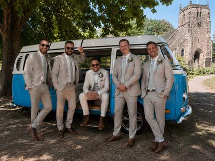 Groomsmen gathered by Mabel before the ceremony, matching tan suits.