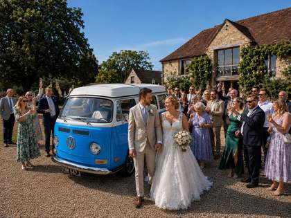 The wedding party gathered together in front of Mabel.
